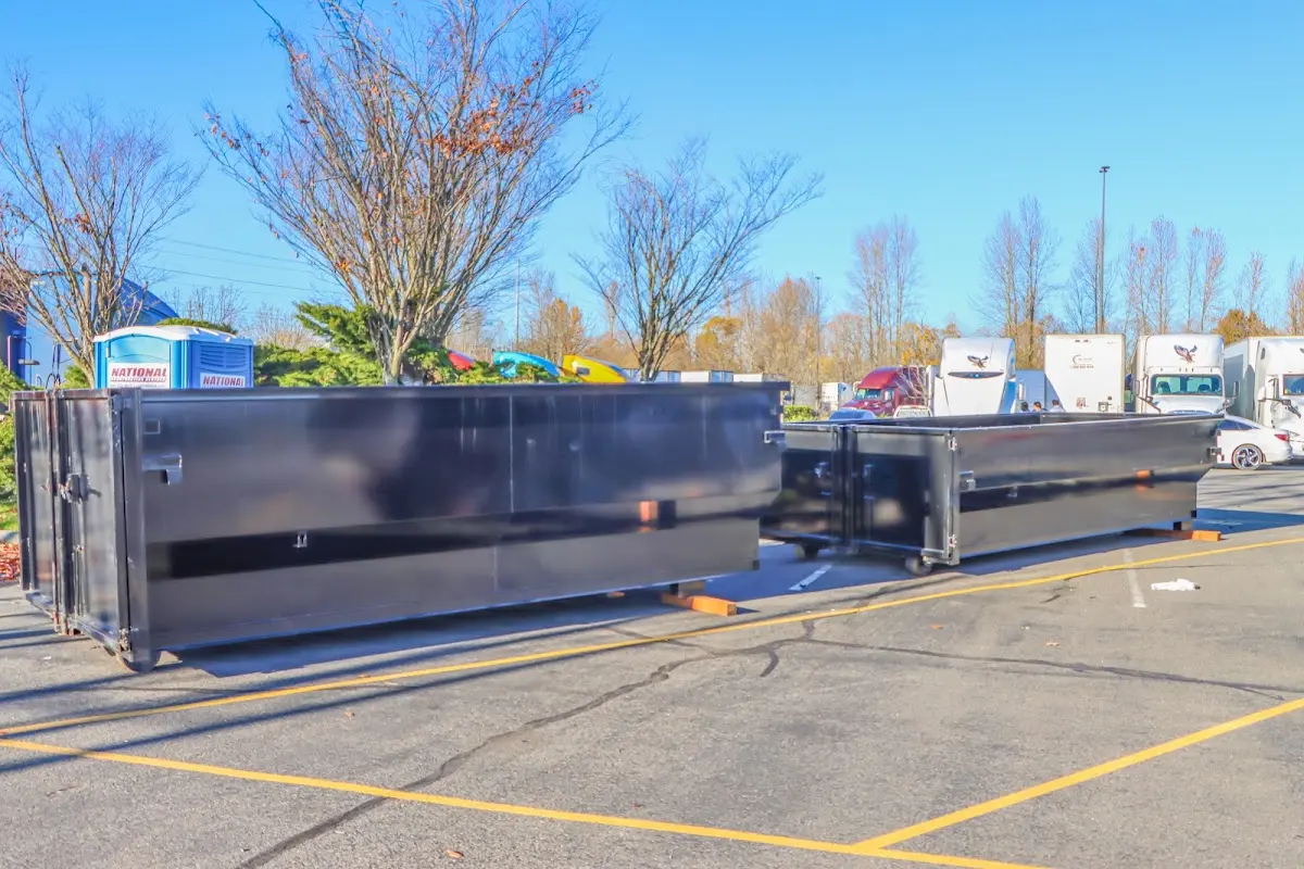 Professional dumpster rental service with roll-off container on residential driveway in Allen